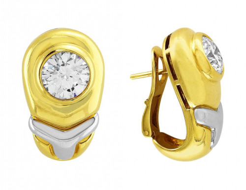 Bulgari diamond earrings. 18k yellow and white gold mountings signed Bulgari. Two brilliant cut diamonds weighing 4.26cttw with G color and VS2 clarity. To buy this product please visit here https://eyeonjewels.com/product/bulgari-diamond-earrings-14077