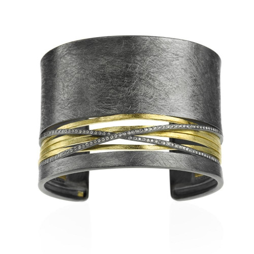 Cuff bracelet with white brilliant cut diamonds 0895ctw in 18k yellow gold and sterling silver with patina. To know more details please visit here https://eyeonjewels.com/product/cuff-bracelet-with-white-brilliant-cut-diamonds-7939