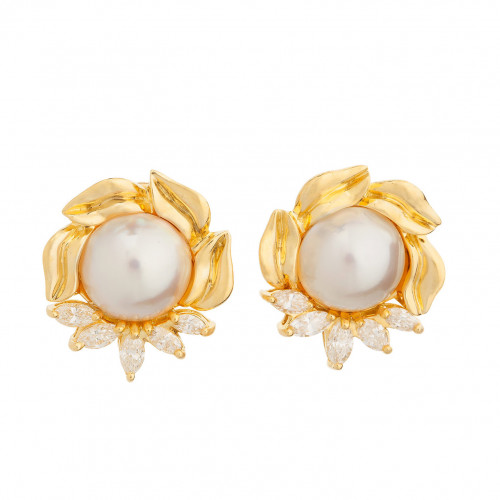 A beautiful pair of mabe pearl and diamond earrings in 18K yellow gold. The 13mm pearls are in a frame of marquise diamonds and gold leaf design. The diamonds have an estimated total weight of 1.10cts. They are graded as G-H color, VS clarity. To buy this product please visit here https://eyeonjewels.com/product/mabe-pearl-diamond-gold-earrings-14052