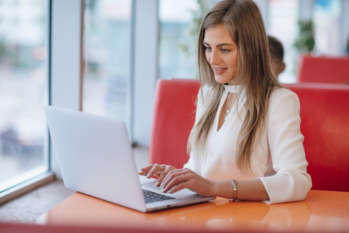 elegant-woman-with-smiling-face-typing-her-laptop_1157-1944.jpg