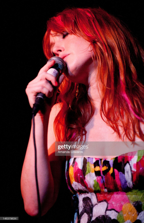 HOLLYWOOD, CA - JUNE 14:  Actress and singer Alicia Witt performs onstage at the release party for h